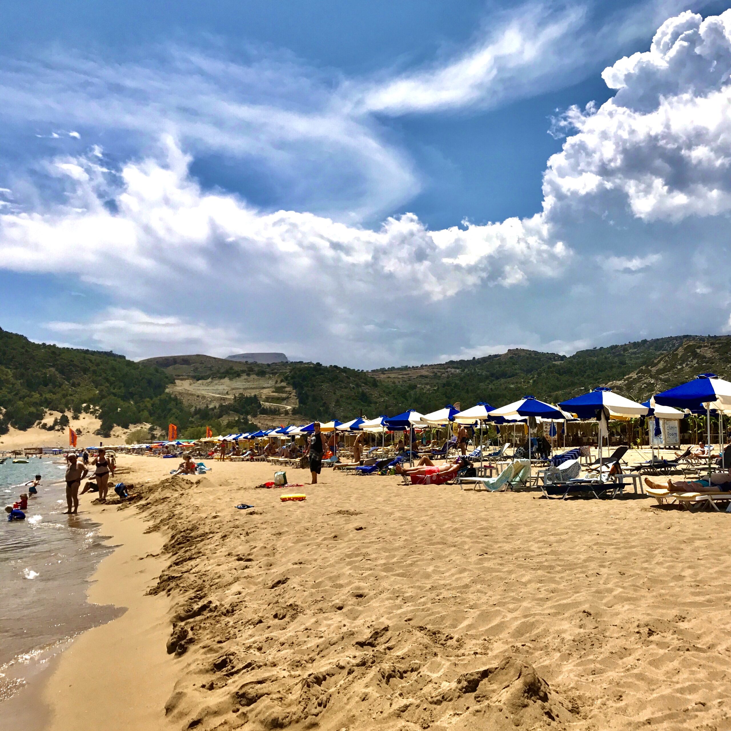 People enjoying sea and sun on Tsambika Beach.
